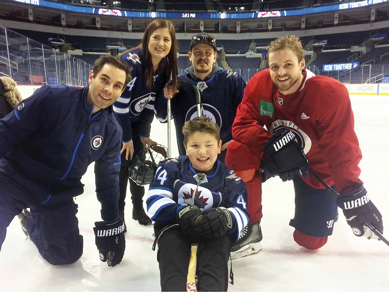 The Sports Corporation NHL Defenceman Josh Morrissey charity work at a Winnipeg Jets practice